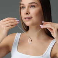 Thumbnail for Model showcasing the elegant Drop Name Necklace by Brother & Sisters, featuring a personalized drop-shaped design.