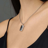 Thumbnail for Envelope Name Necklace by Brother & Sisters, personalized silver pendant necklace worn elegantly on a woman.