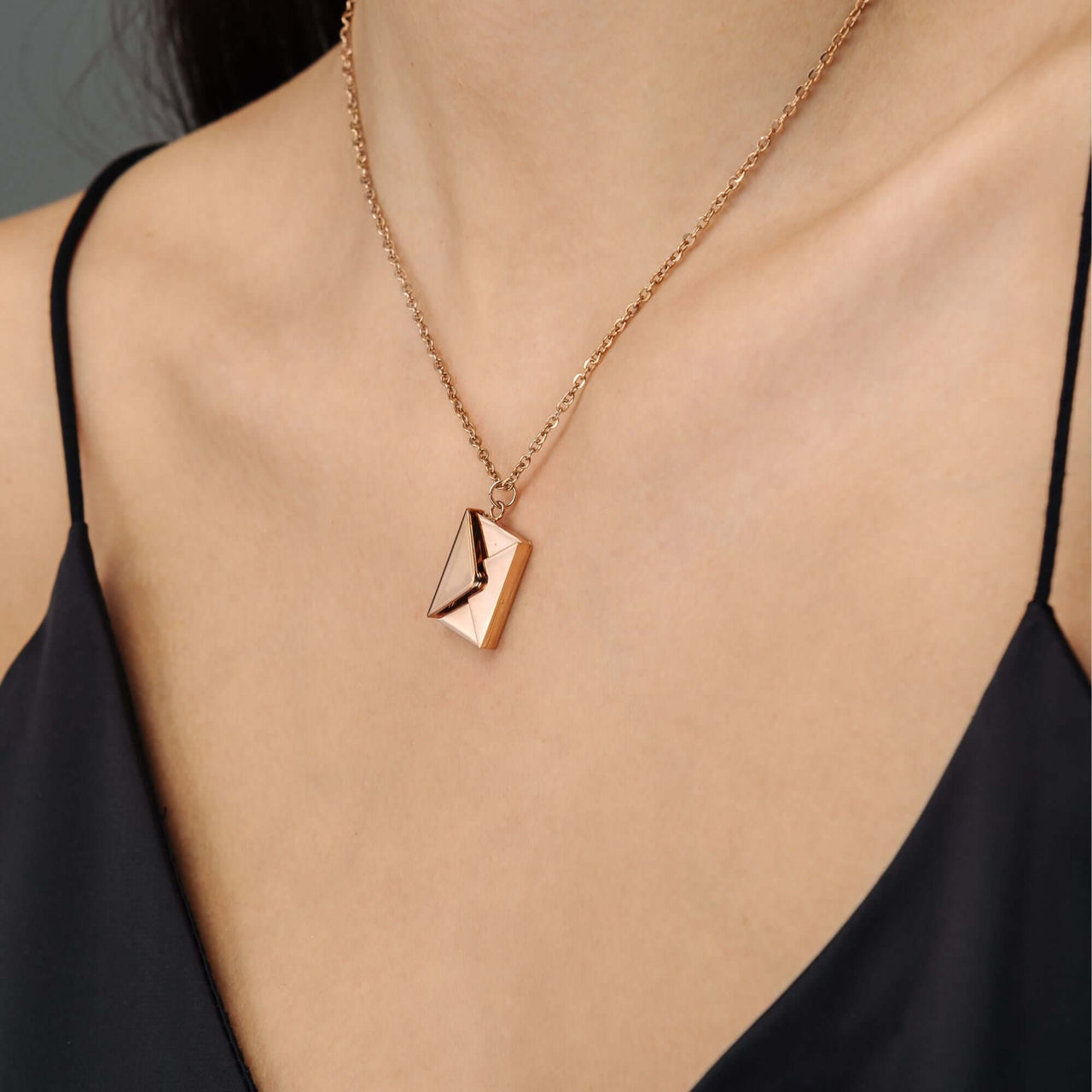 Envelope Name Necklace by Brother & Sisters worn as a chic accessory, blending elegance with personalization.