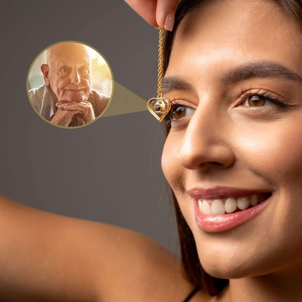Eternal Photo Necklace held by a woman, showcasing a cherished photo within its heart charm by Brother & Sisters.