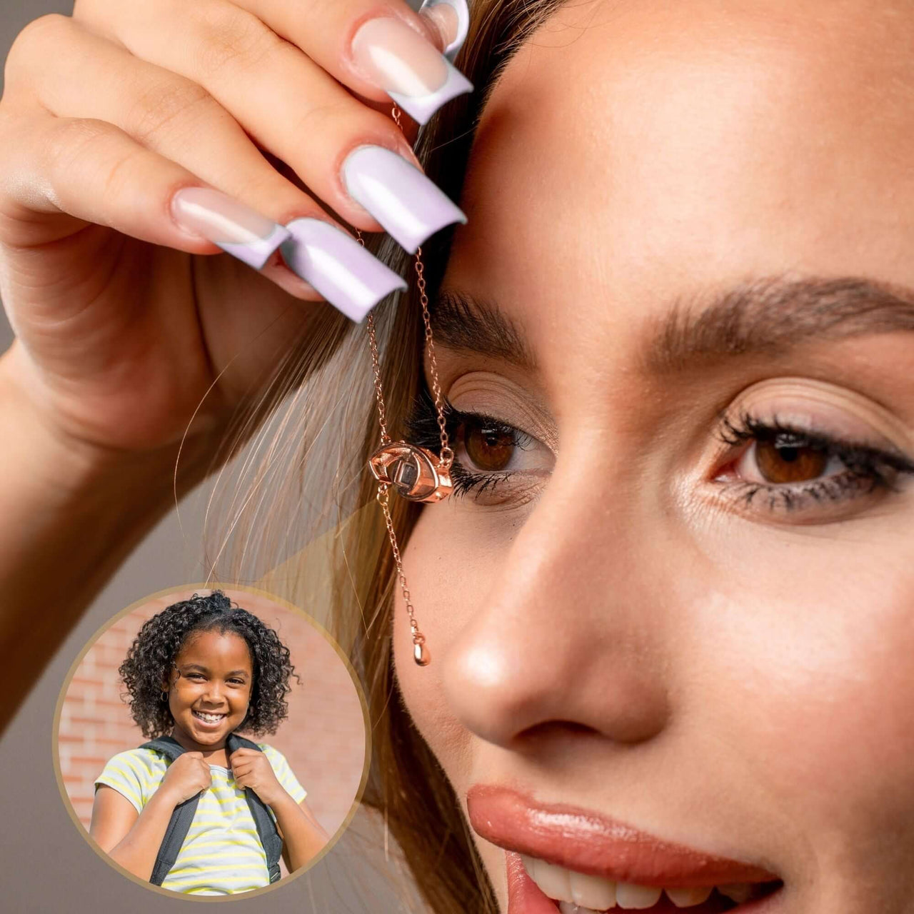 Close-up of a woman holding the Eye Photo Necklace by Brother & Sisters, showcasing customizable photo projection.