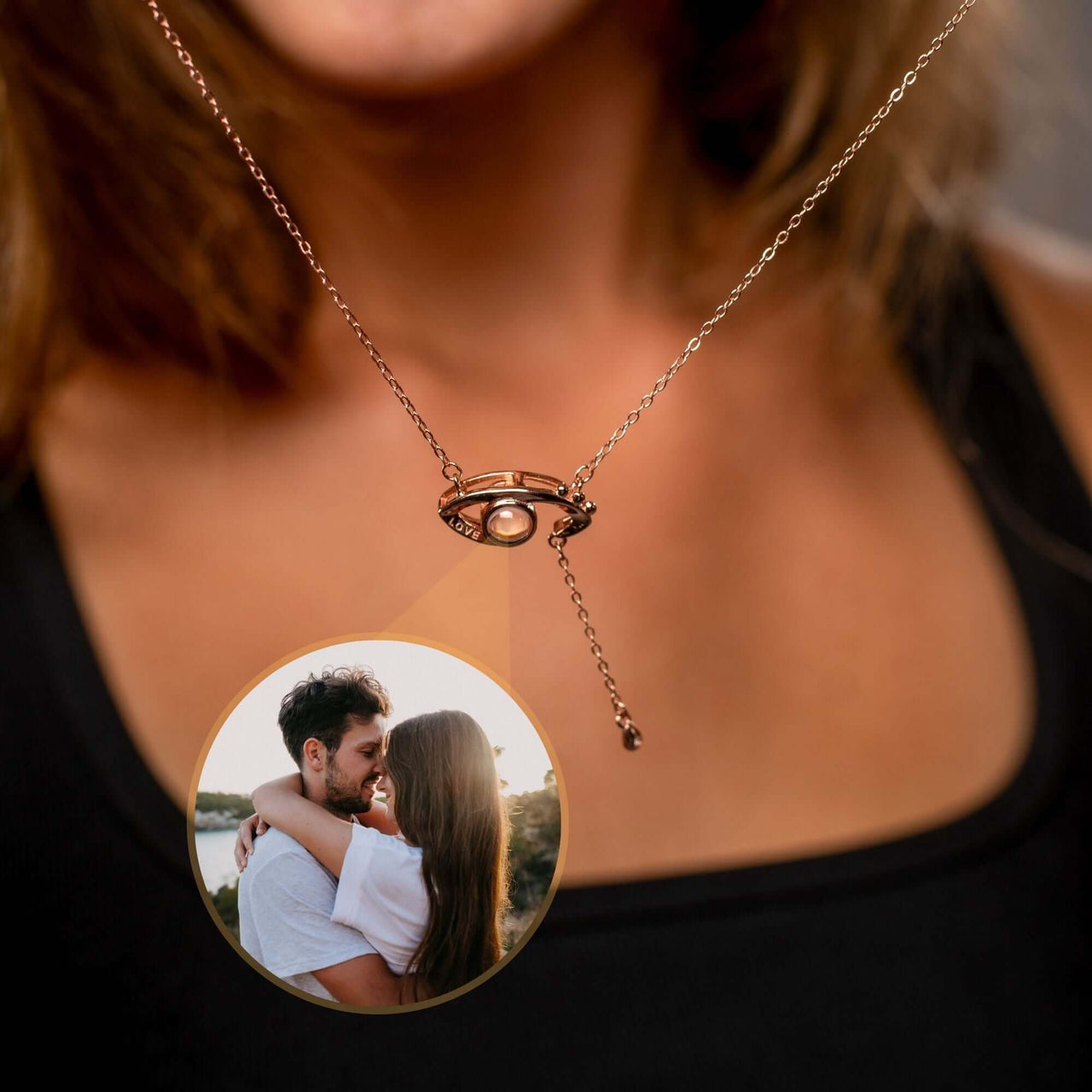 Close-up of Eye Photo Necklace featuring customizable photo projection by Brother & Sisters, showcasing a couple's image.