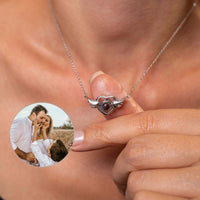 Thumbnail for Flying Heart Photo Necklace featuring a heart pendant with wings and a personal photo insert by Brother & Sisters.