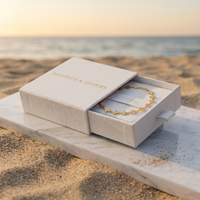 Thumbnail for Daisy Charm Anklet in a Brother & Sisters box, a beautiful gold piece representing summer vibes.