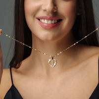Thumbnail for Feminine Initial Necklace worn by a woman, featuring gold heart pendant, designed by Brother & Sisters.