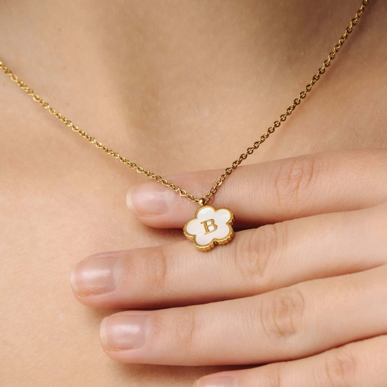 Flower Initial Necklace by Brother & Sisters featuring a gold floral design with a personalized letter 'B'.