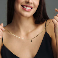 Thumbnail for Harmony Initial Necklace worn by a woman, featuring a refined letter pendant in gold, by Brother & Sisters.