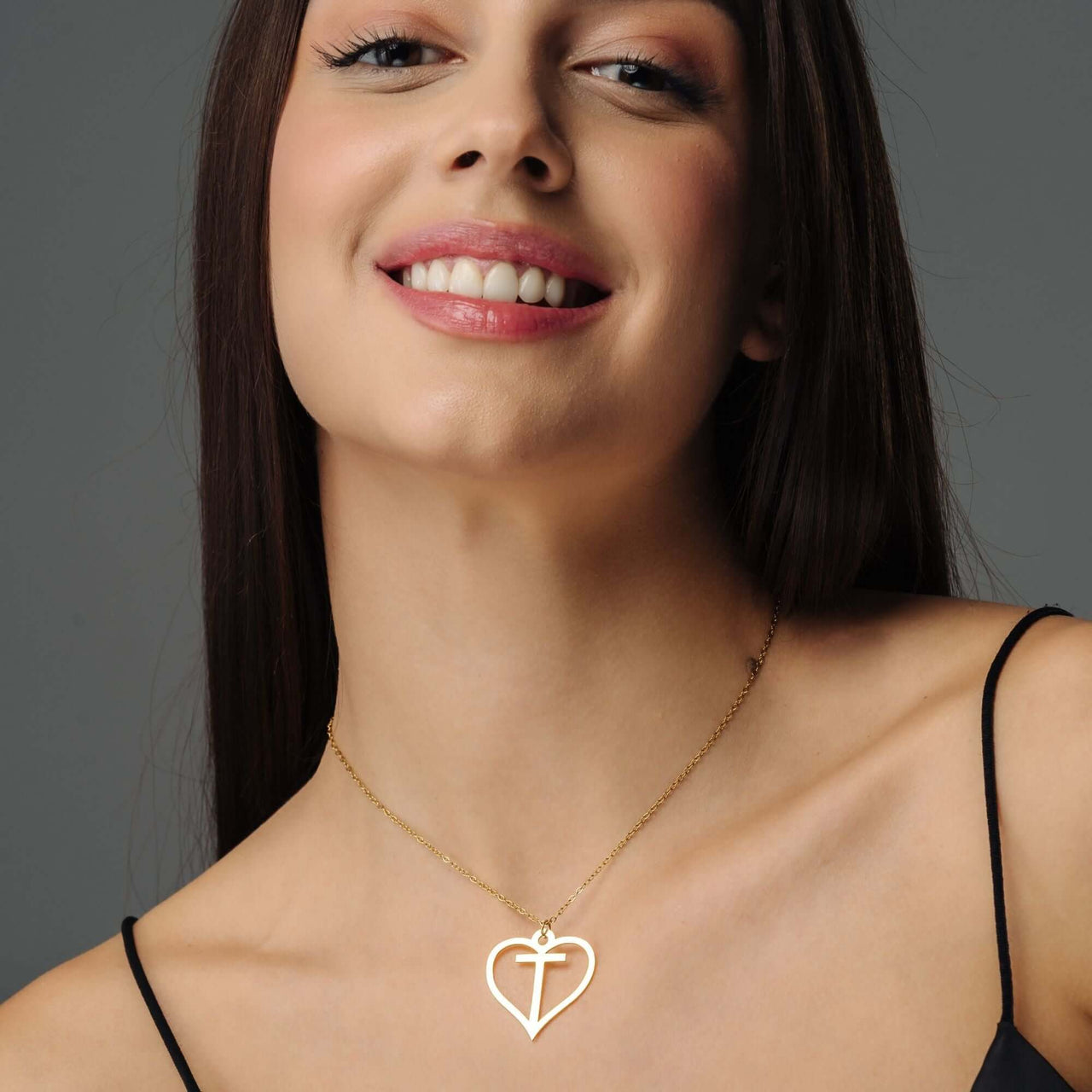 Heart Initial Necklace worn by a woman, showcasing the gold design and elegance from Brother & Sisters.