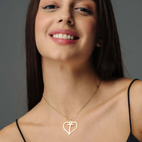 Thumbnail for Heart Initial Necklace worn by a woman, showcasing the gold design and elegance from Brother & Sisters.