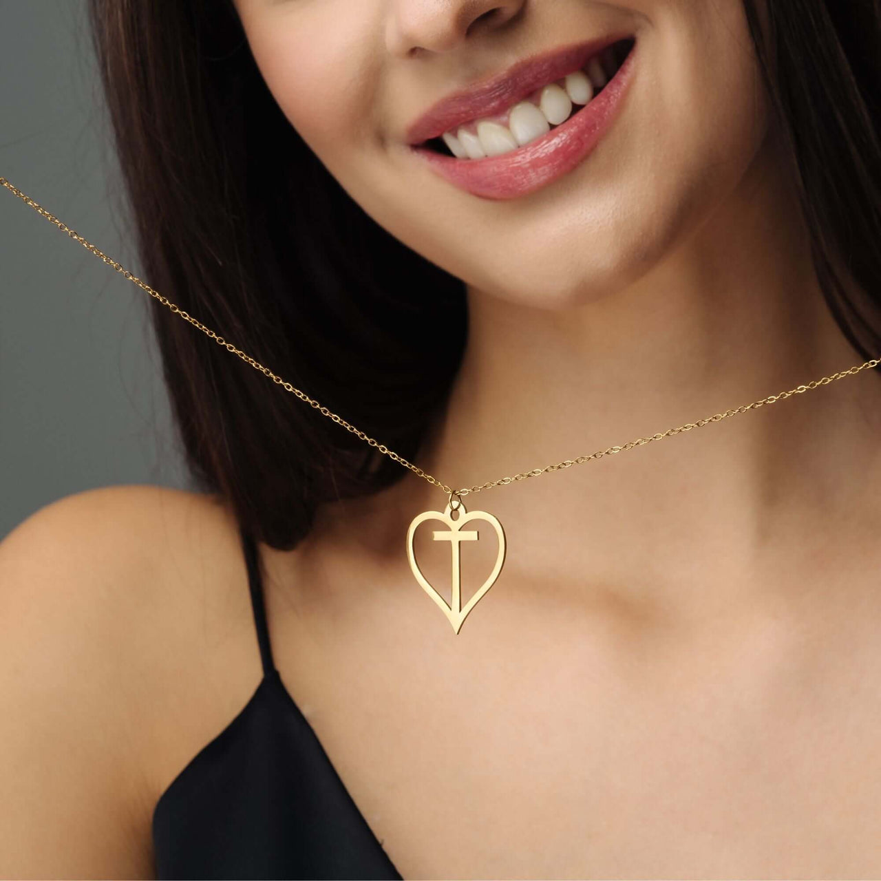Heart Initial Necklace worn by a woman, featuring a delicate gold design, from Brother & Sisters.