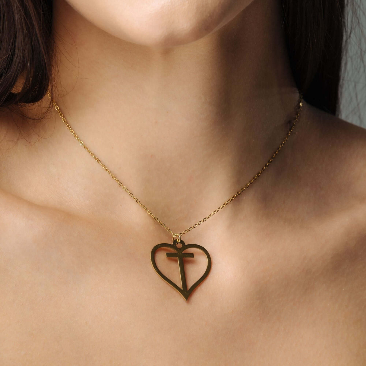 Heart Initial Necklace from Brother & Sisters featuring a gold heart pendant with an initial.