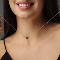 Thumbnail for Love Initial Necklace worn by a woman featuring a gold chain and customizable initial charm from Brother & Sisters.