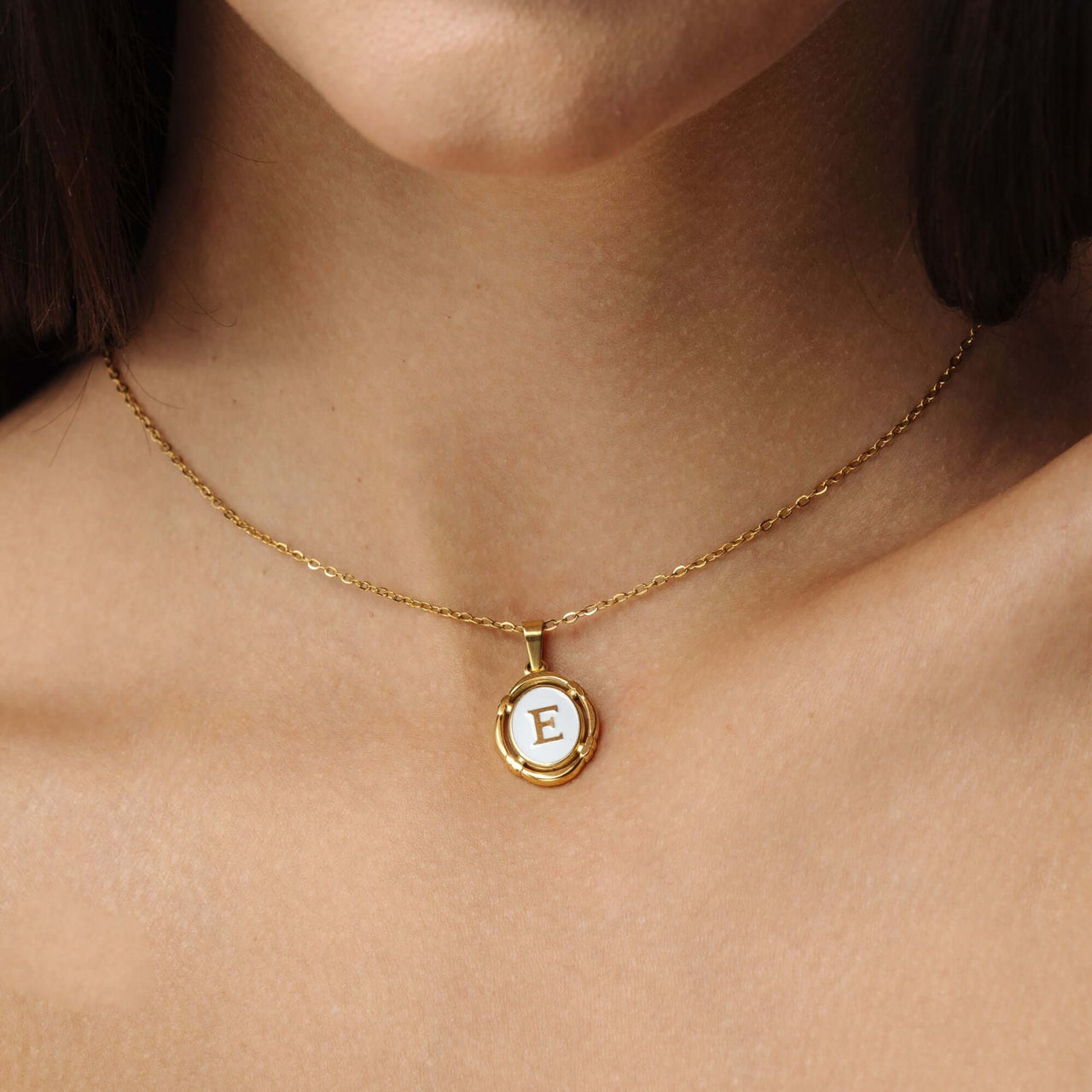 Princess Initial Necklace by Brother & Sisters, featuring a delicate gold chain with a personalized E pendant.