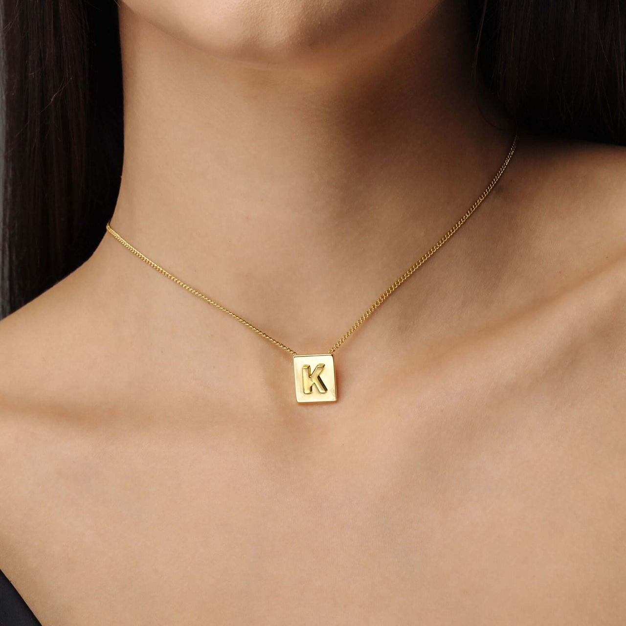 Rectangle Initial Necklace by Brother & Sisters, a gold necklace featuring a personalized initial in minimalist design.