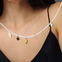 Thumbnail for Summer Initial Necklace featuring ocean-inspired charms and gold accents by Brother & Sisters