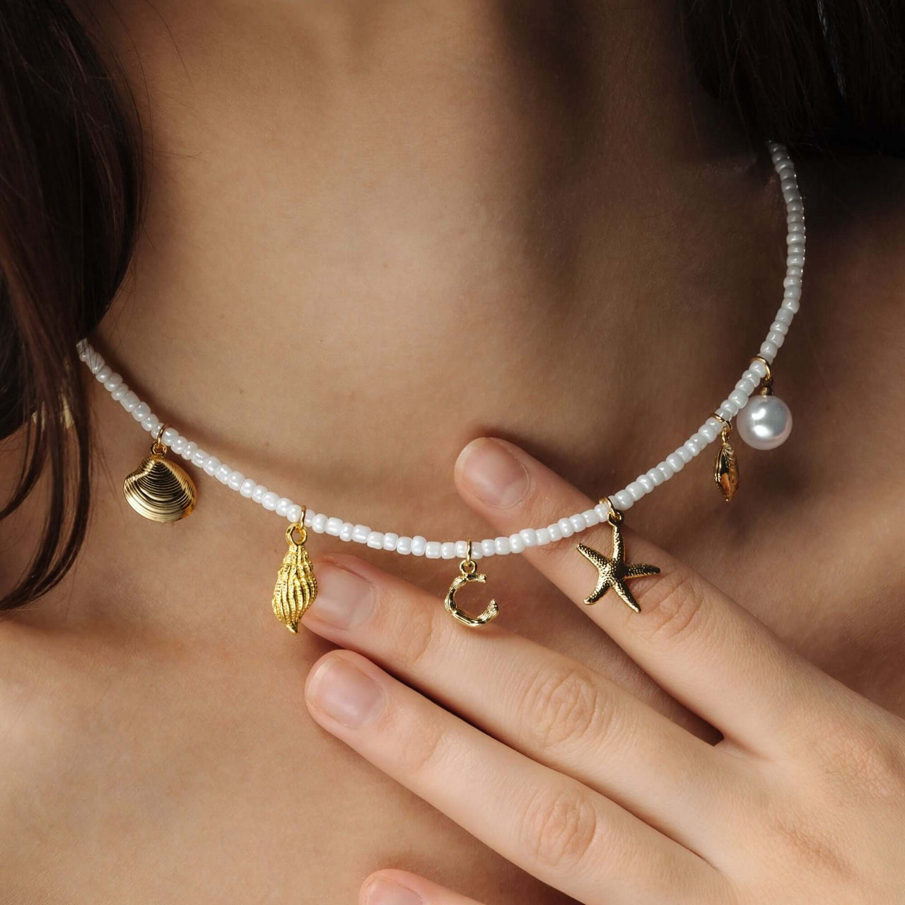 Summer Initial Necklace featuring seashell and ocean-inspired charms by Brother & Sisters, perfect for beachy elegance.