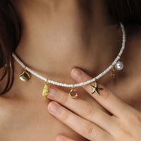 Thumbnail for Summer Initial Necklace featuring seashell and ocean-inspired charms by Brother & Sisters, perfect for beachy elegance.