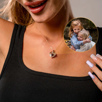 Thumbnail for Hearts Photo Necklace worn by a woman showcasing children's photo locket, designed by Brother & Sisters.