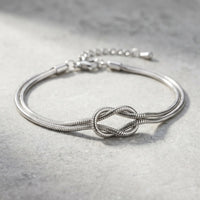 Thumbnail for Knot Couple Bracelet silver macro detail flat on stone surface