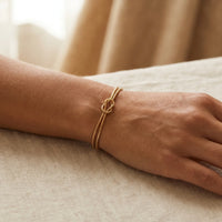 Thumbnail for Knot Couple Bracelet gold worn intimate cozy interior