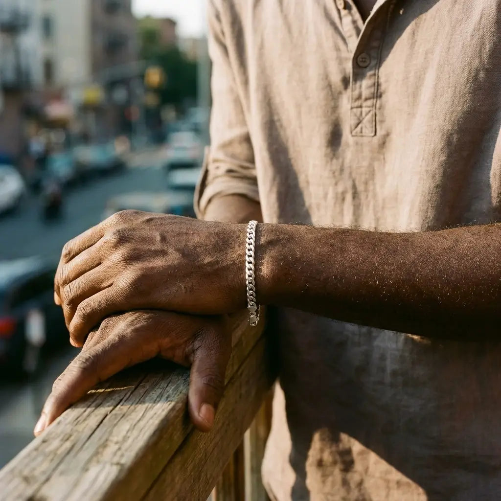 Senegalese man wearing His silver Heart Bond bracelet, urban Brooklyn