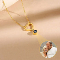 Thumbnail for Infinite Love Photo Necklace by Brother & Sisters, heart-shaped pendant projecting a cherished photo.