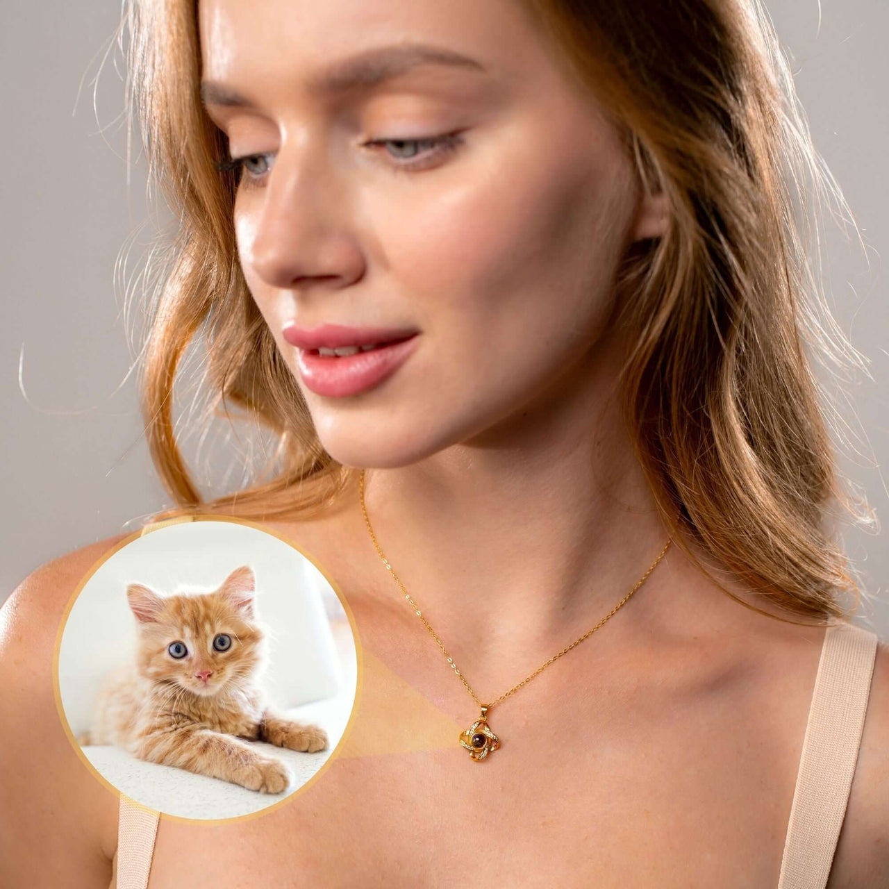 Model wearing Infinite Photo Necklace featuring a personalized photo of a cute orange kitten by Brother & Sisters.