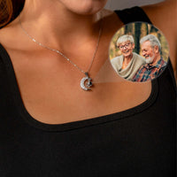 Thumbnail for Lucky Moon Photo Necklace worn by a woman, featuring a memory projection and a photo of loved ones.