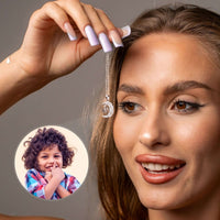 Thumbnail for Lucky Moon Photo Necklace held by a woman with a visible photo of a child, showcasing Brother & Sisters elegant jewelry.