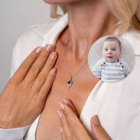 Thumbnail for Luxury Photo Necklace worn by a woman, showcasing a hidden photo of a baby in the elegant pendant by Brother & Sisters.