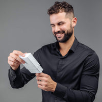 Thumbnail for Man smiling while opening a gift box of the Classic Photo Bracelet by Brother & Sisters.
