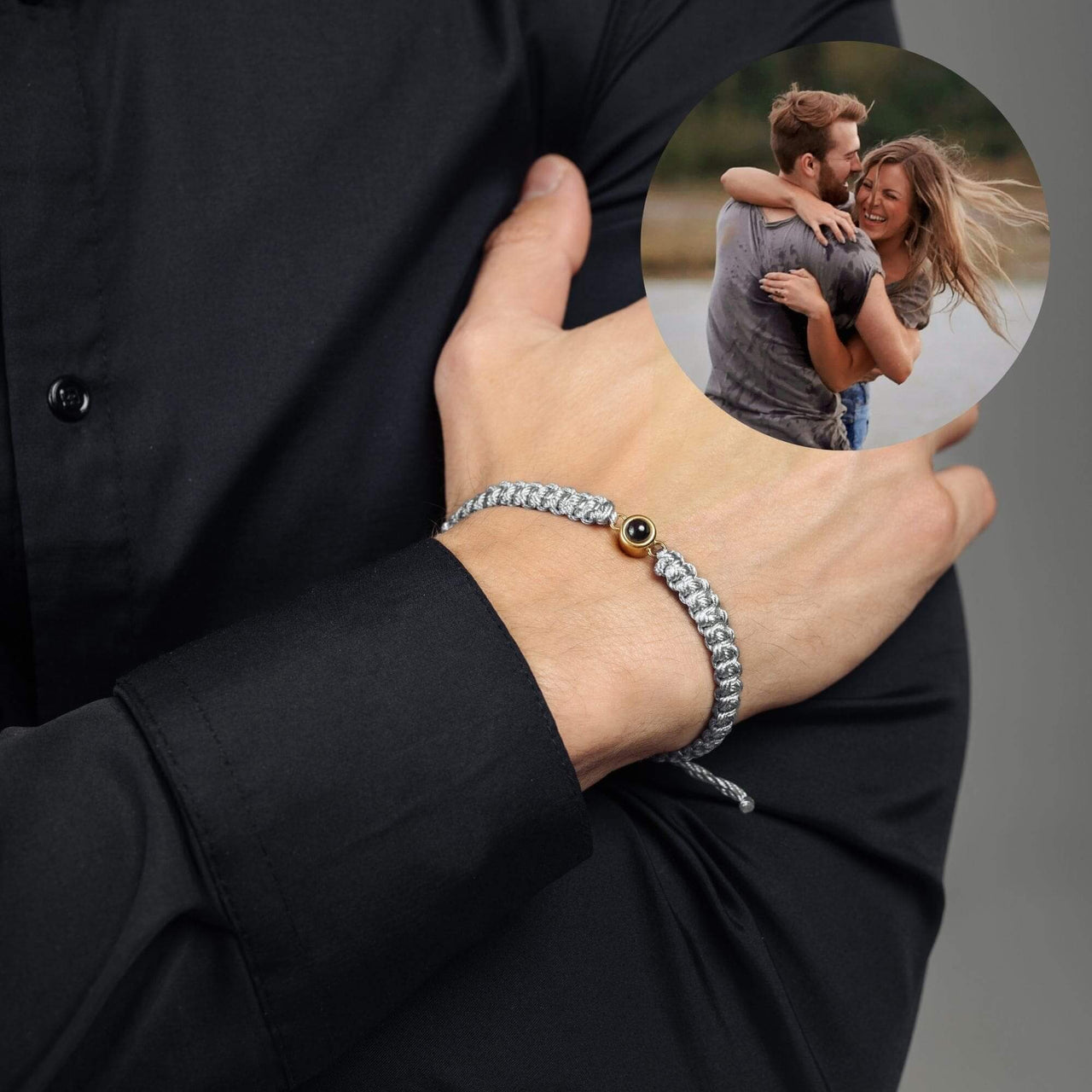 Man Grey Photo Bracelet worn on wrist, with a photo of a couple embracing, by Brother & Sisters.