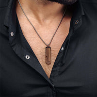 Thumbnail for Charming Initial Necklace worn by a man featuring a sleek letter pendant, by Brother & Sisters, stylish men's accessory.