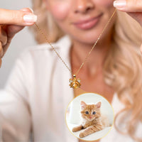 Thumbnail for Meow Photo Necklace held by a woman showcasing personalized cat photo projection by Brother & Sisters.