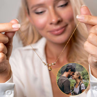 Thumbnail for Nature Photo Necklace by Brother & Sisters held by a woman, featuring a personal photo projection for special memories.