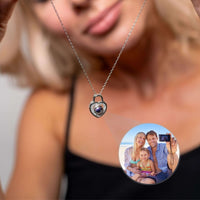 Thumbnail for Woman wearing a beautiful Padlock Photo Necklace by Brother & Sisters, showcasing a family photo inside.