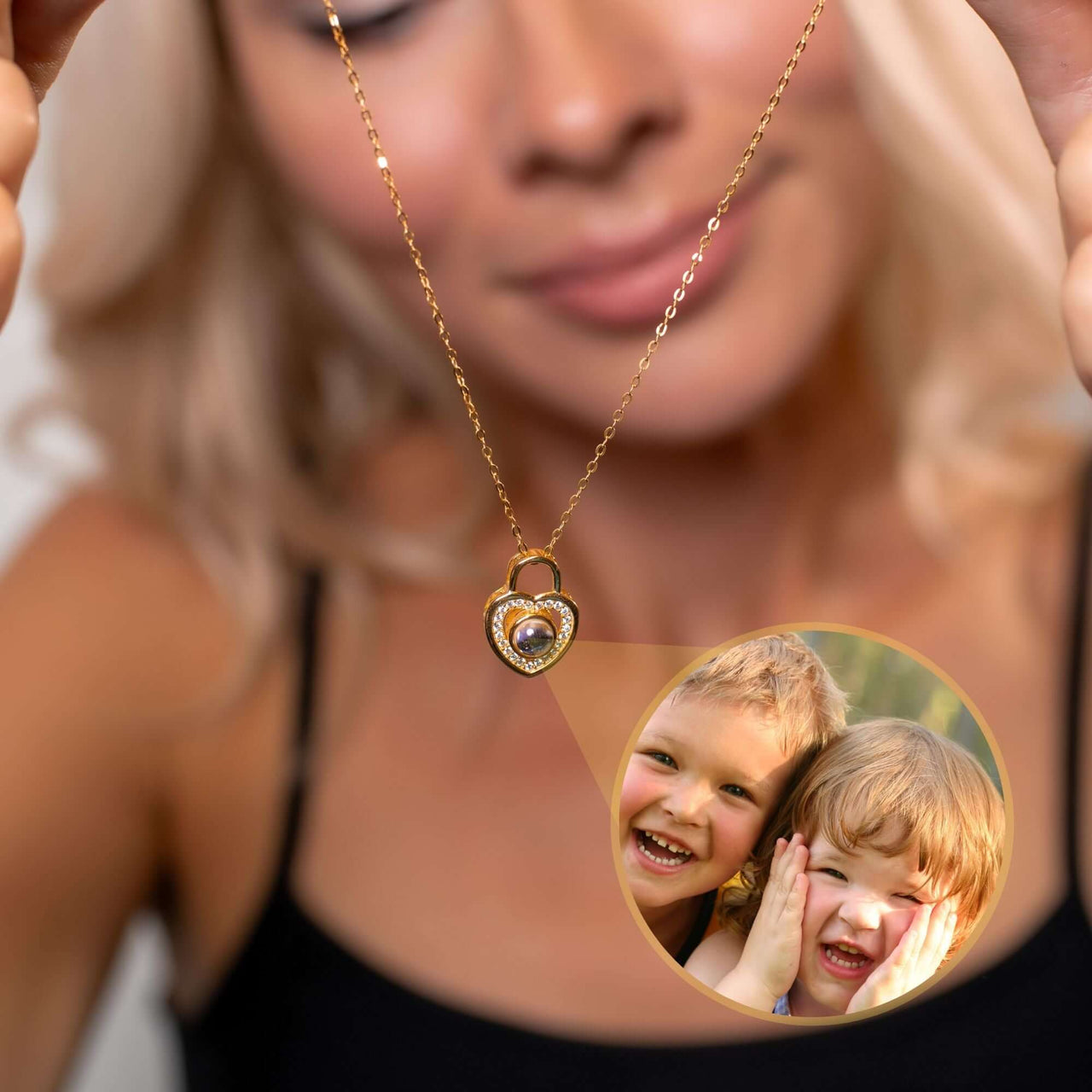 Woman showcasing a Padlock Photo Necklace by Brother & Sisters, featuring a photo of smiling children inside.