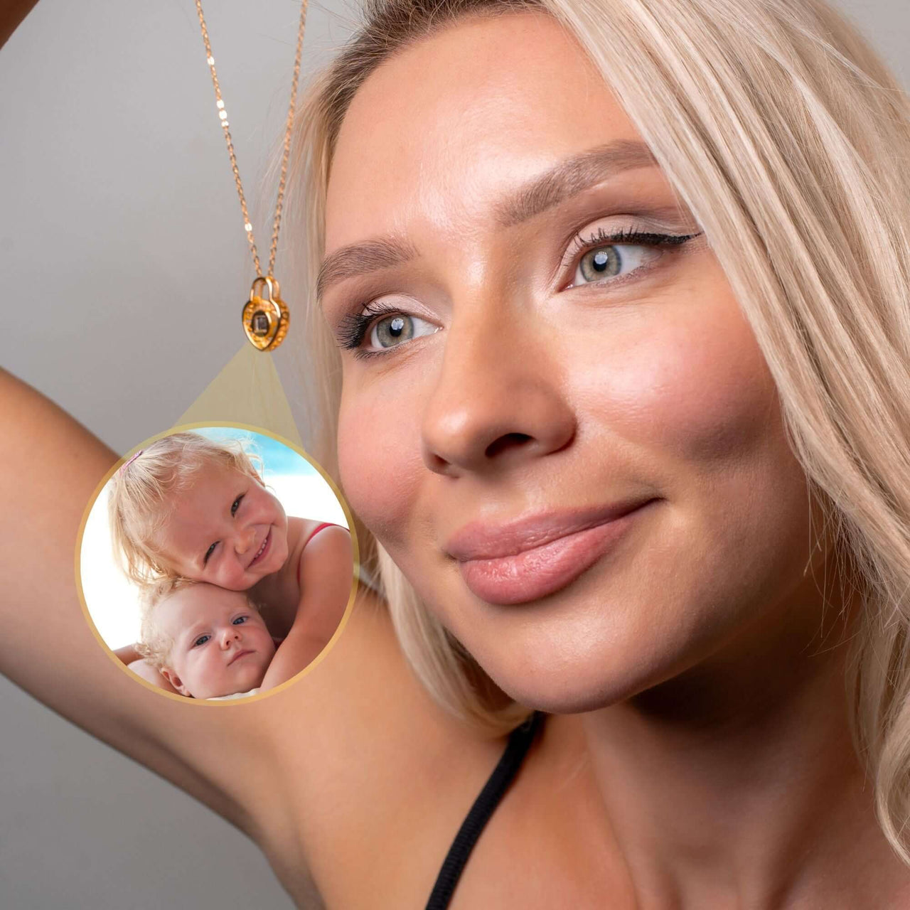 Woman wearing a Padlock Photo Necklace by Brother & Sisters, showcasing a photo of her children inside the pendant.