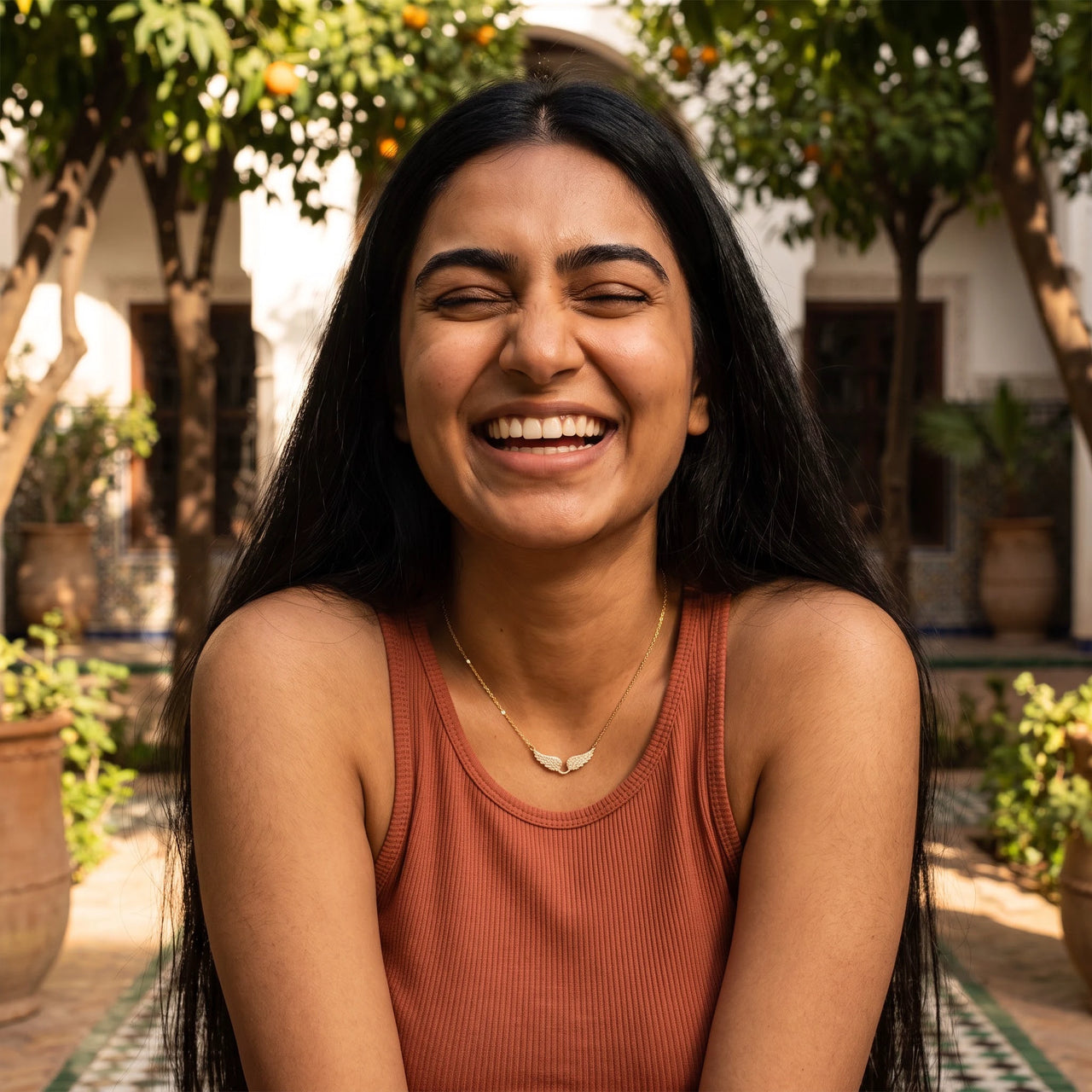 Woman laughing, wearing the gold necklace | SKU: 42002-gold