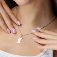 Thumbnail for Close-up of a woman wearing a Paw Name Necklace by Brother & Sisters, showcasing its elegant design and personalization.