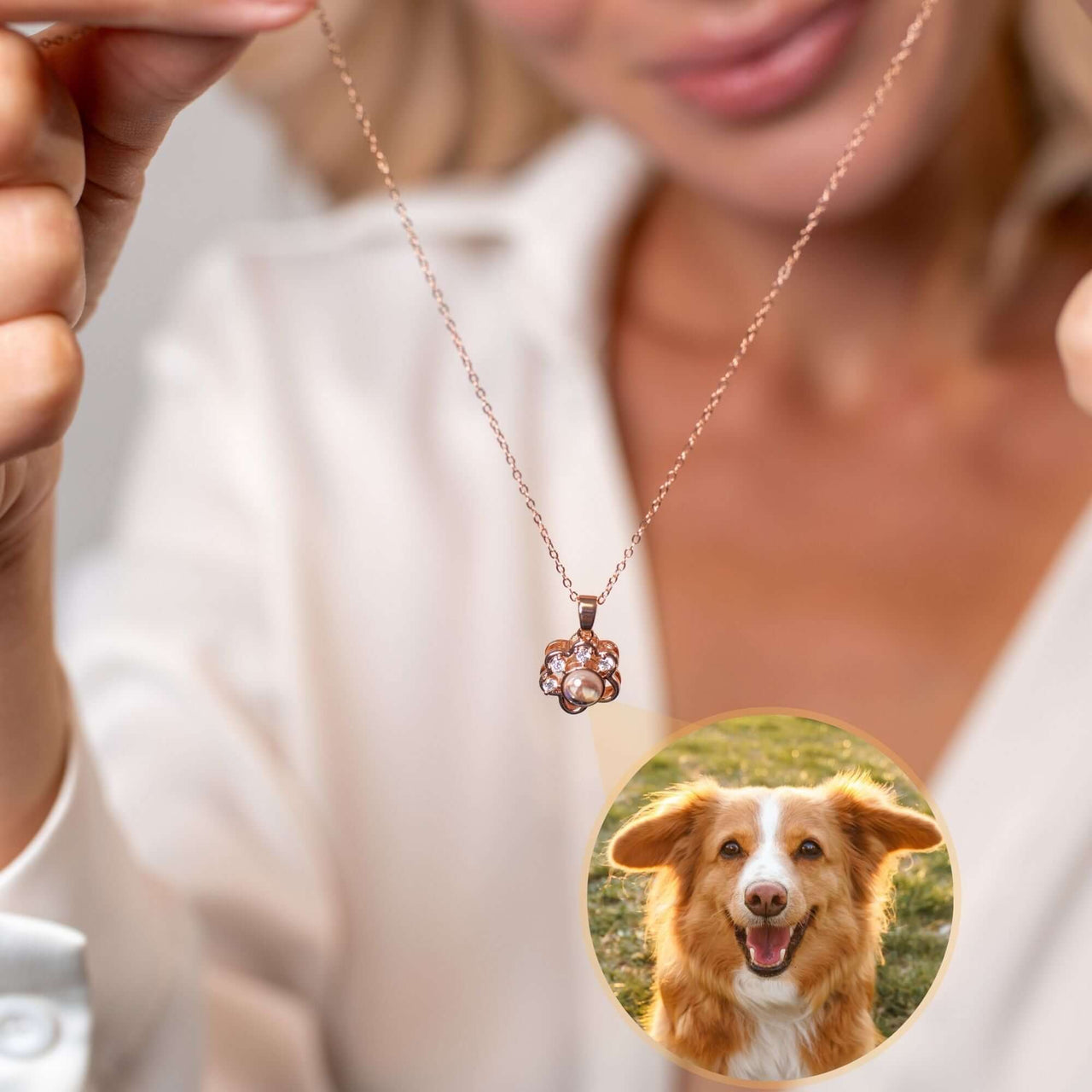 Woman holding Paw Print Photo Necklace showcasing personalized pet photo, designed by Brother & Sisters.