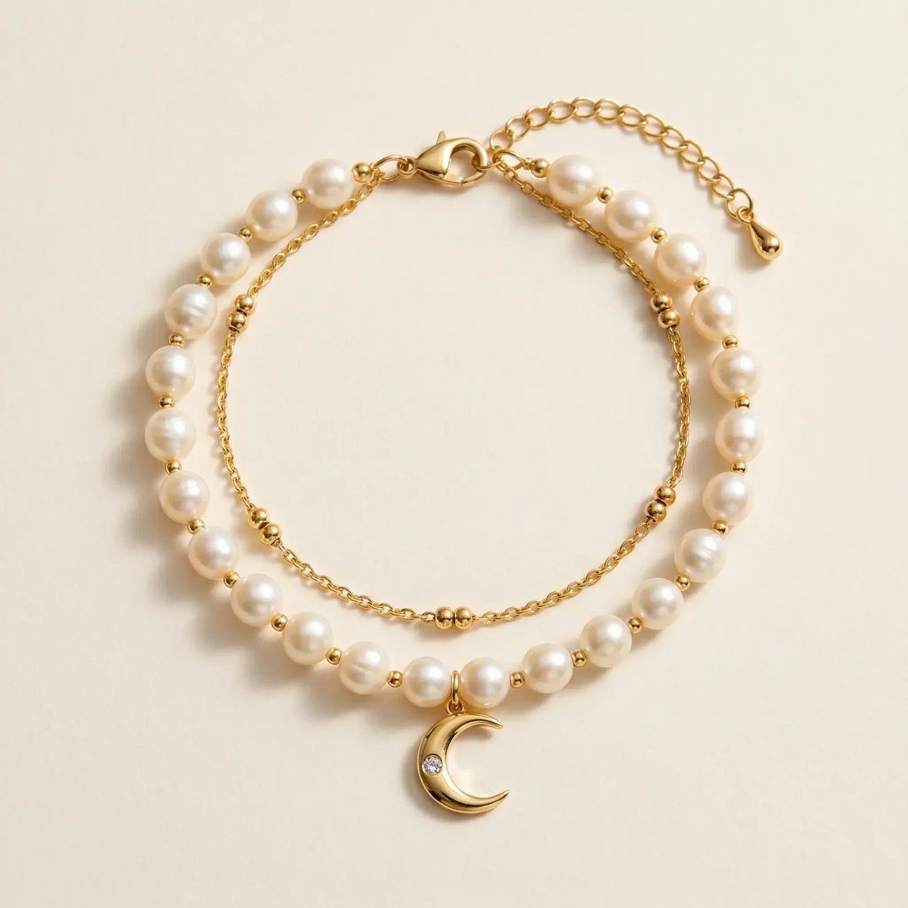 Pearl Moon Anklet Set featuring gold cable, cream pearls, and a crescent moon charm by Brother & Sisters.