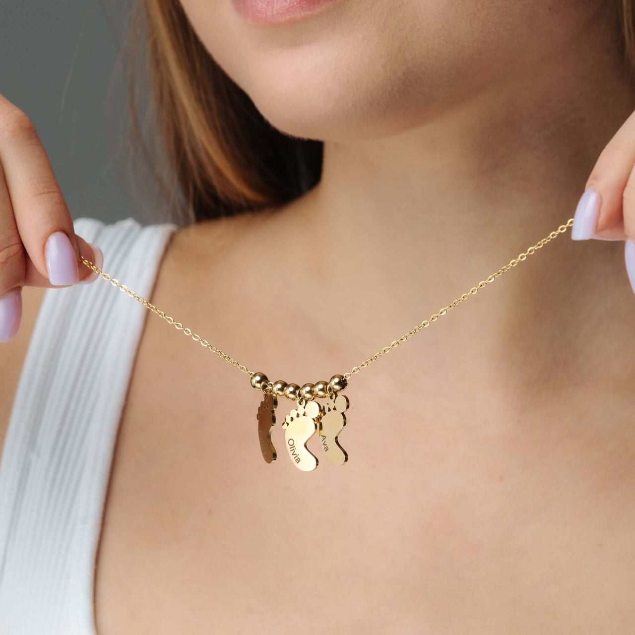 Child Name Necklace from Brother & Sisters, featuring custom name pendants in gold for a unique charm.