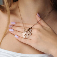 Thumbnail for Child Name Necklace by Brother & Sisters, featuring a personalized design with scattered charms on a delicate chain.
