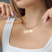 Thumbnail for Queen Name Necklace by Brother & Sisters featuring a gold pendant with personalized name, perfect for elegant style.