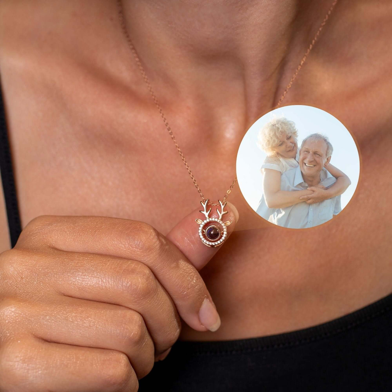 Close-up of a Reindeer Photo Necklace by Brother & Sisters featuring a cherished photo insert and festive design.