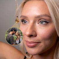 Thumbnail for Reversed Heart Photo Necklace worn by a woman, showcasing a beautiful photo of a couple inside the pendant.