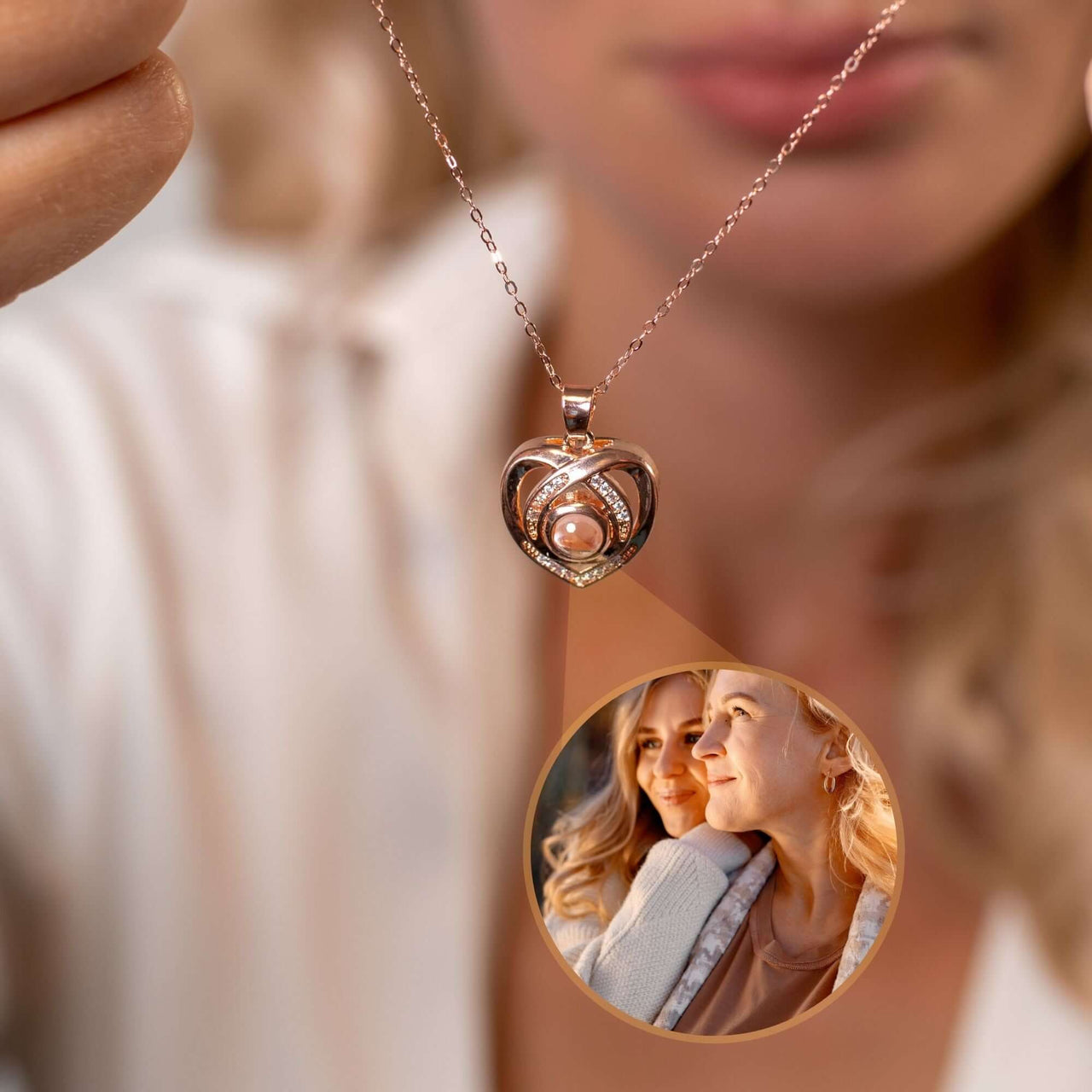 Romance Photo Necklace featuring a heart-shaped pendant with a photo projection, by Brother & Sisters.