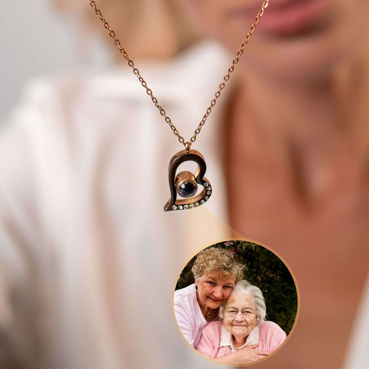 Romantic Photo Necklace by Brother & Sisters with a heart design projecting a cherished photo of loved ones.