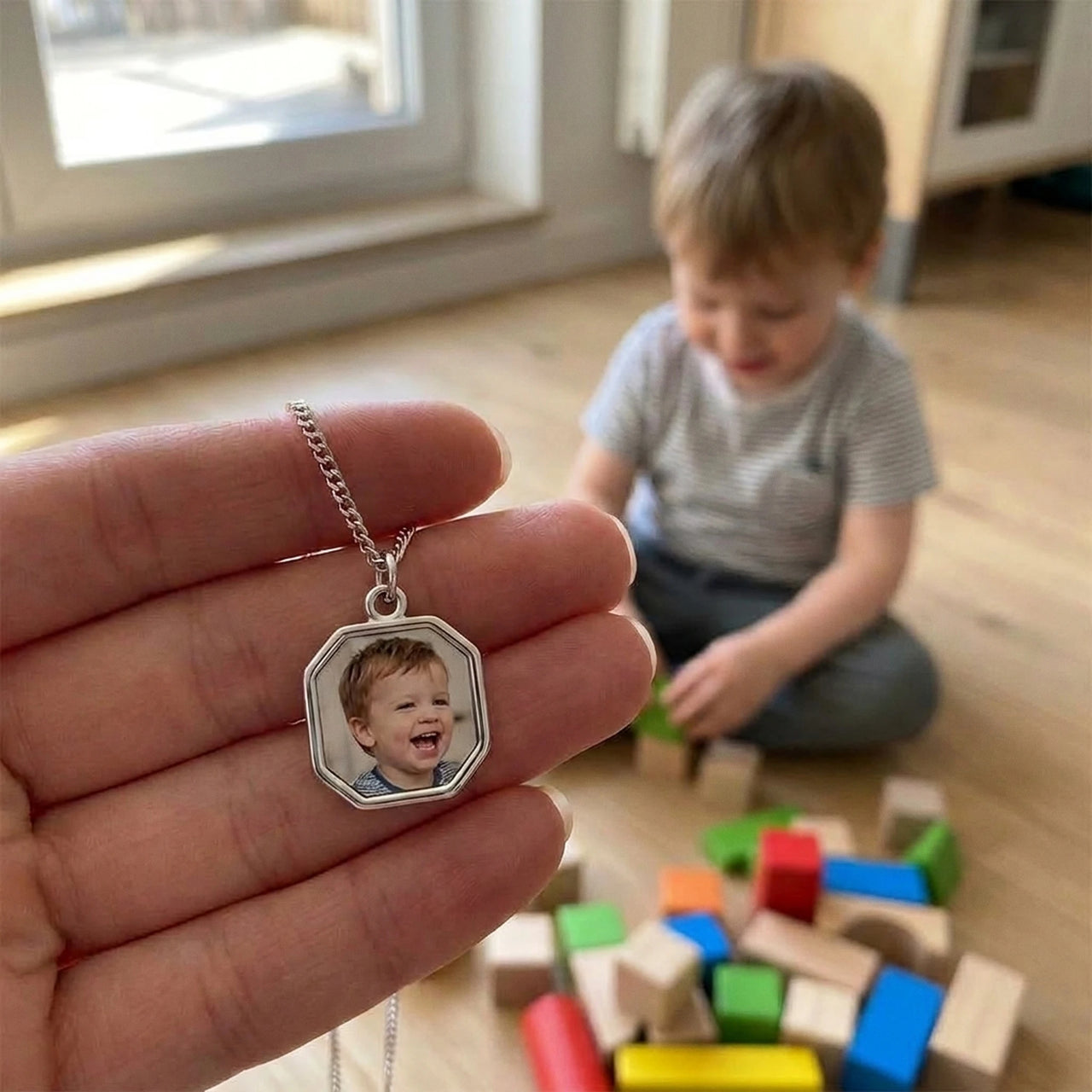 Customer photo: the silver octagon necklace with her son's photo, her son in the background | SKU: TPH-OCTN-SILVER